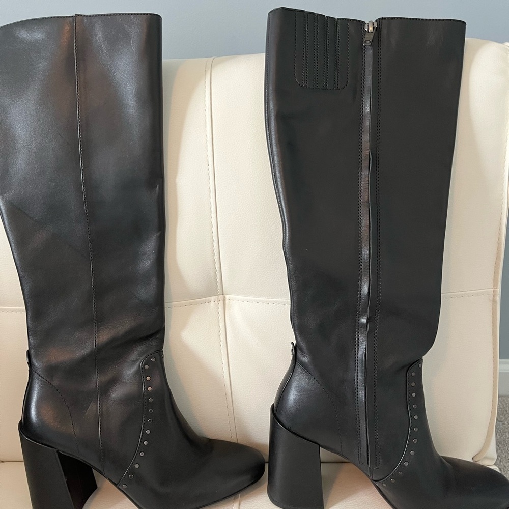 Women’s tall Coach boots with high heels.